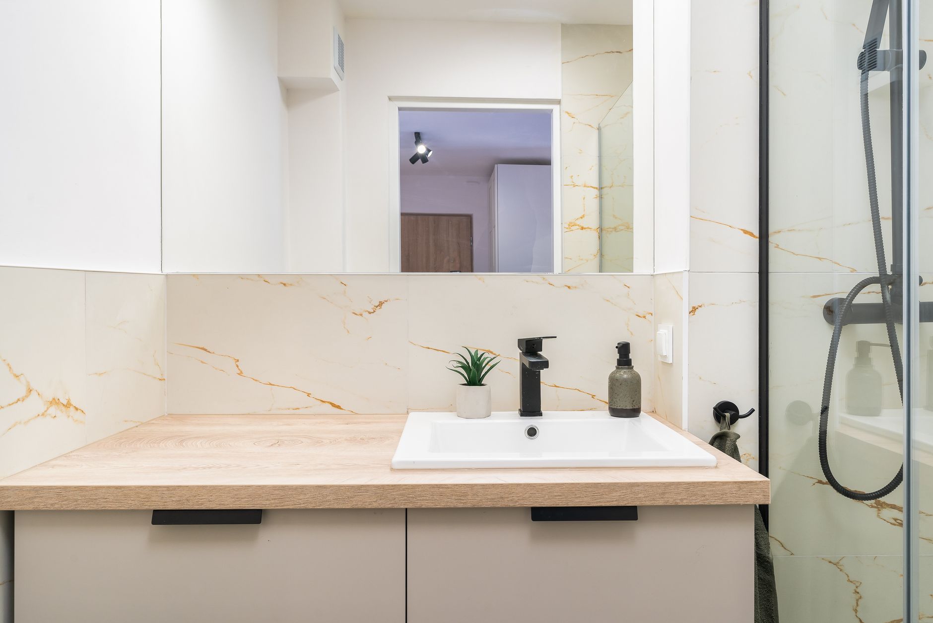 A bathroom vanity with a wood countertop